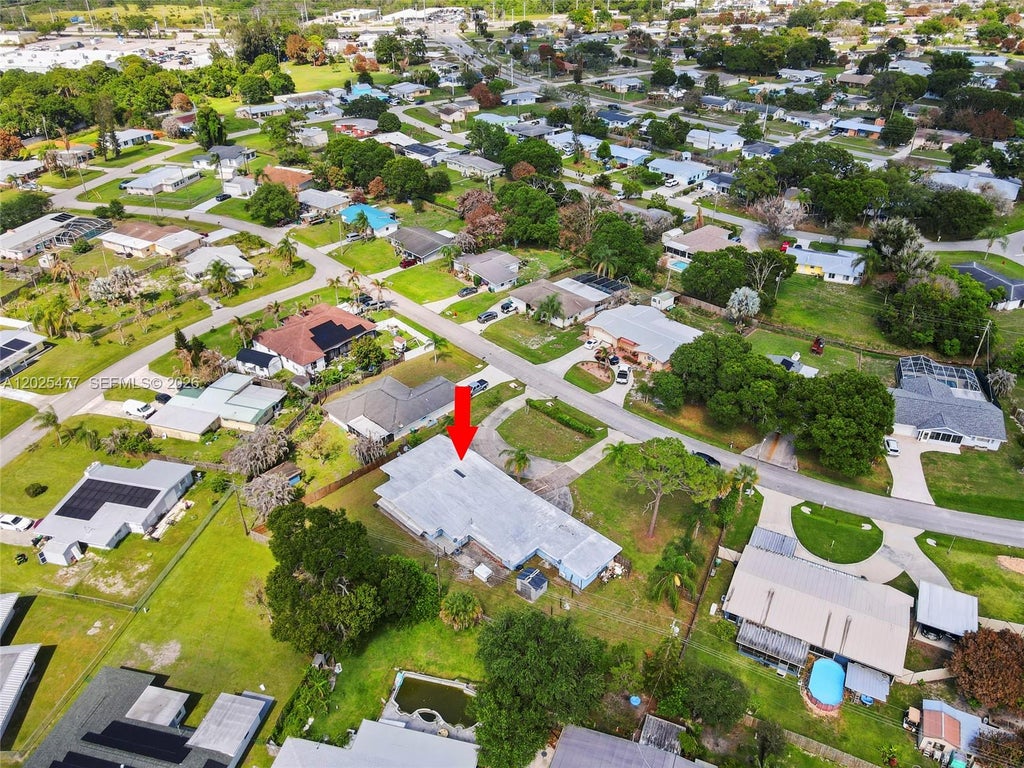 Photo of 310 E Olive Ave, Port St Lucie, FL 34952 (MLS # A12025477)
