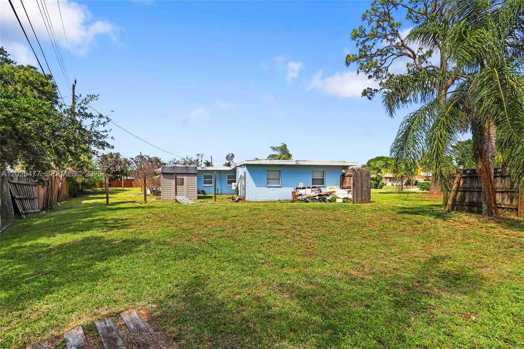 Photo of 310 E Olive Ave, Port St Lucie, FL 34952 (MLS # A12025477)