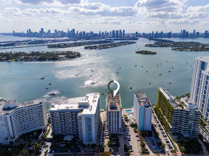 Soak in panoramic views of Miami Beach from this light-filled 1BD/1.5BA, 860 SF condo—the largest 1-bedroom line in the building. Floor-to-ceiling windows, sleek tile floors, and stylish finishes create a modern coastal vibe throughout. The updated kitchen features stainless steel appliances, granite countertops, and wine storage—perfect for entertaining. Spacious bedroom with ample storage and a dedicated workspace. Enjoy ocean breezes from your private balcony, a bayfront pool, gym, bike storage, and 1 parking spot. Perfect as a primary home or vacation getaway in the heart of South Beach, near top dining, shopping, and entertainment.