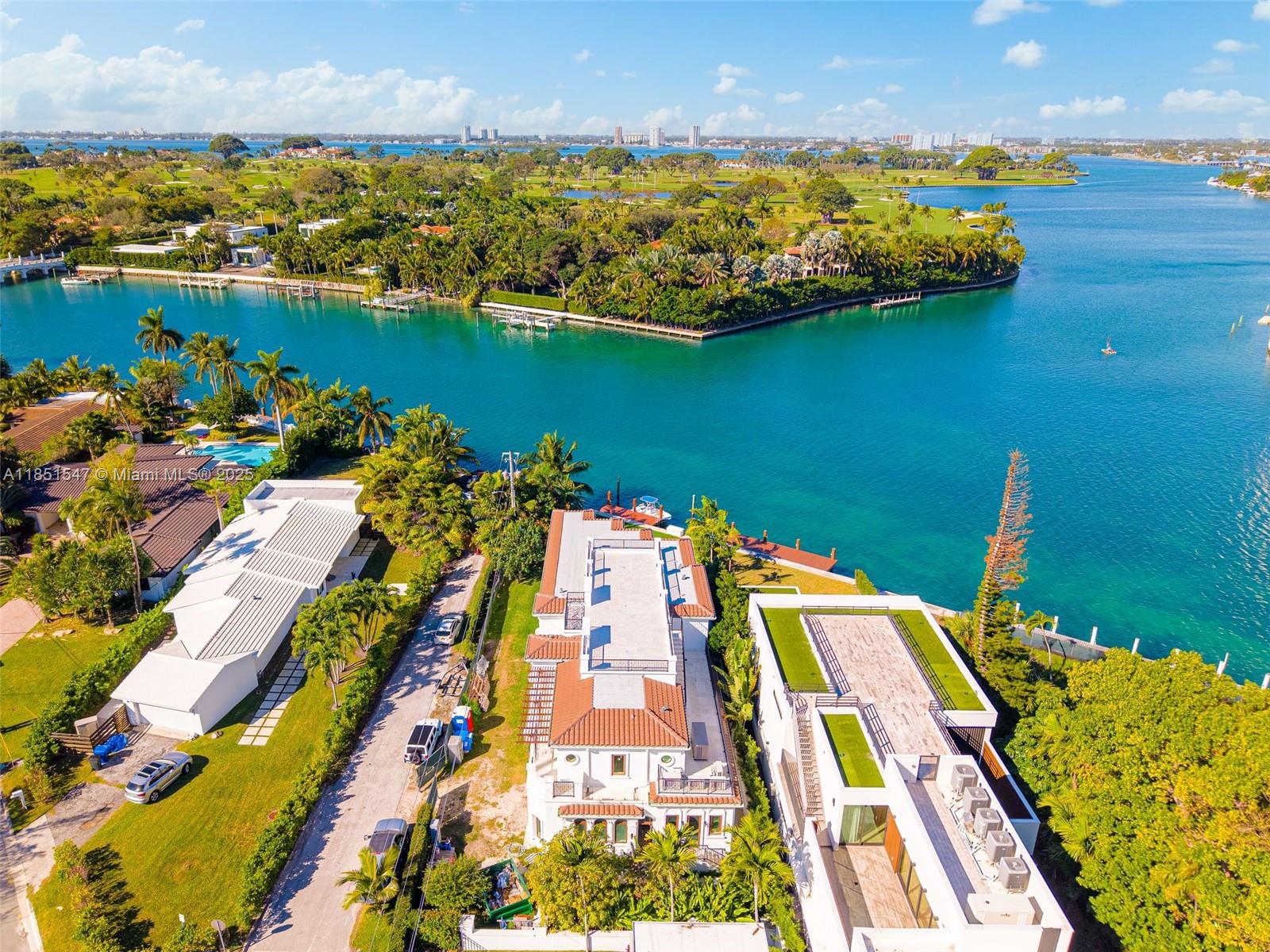 Exceptional Waterfront New Construction – Indian Creek Adjacent. An extraordinary offering in Surfside: this waterfront estate, adjacent to prestigious Indian Creek, redefines modern coastal luxury. Encompassing 7,000 SF, the 6-bedroom, 7-bath residence showcases refined architecture, sweeping water views, and a prime corner lot. Enjoy a massive rooftop terrace ideal for entertaining from sunrise to sunset. Delivered with impeccable custom design and finishes throughout. Moments from the beach, Bal Harbour Shops, fine dining, and top schools; this is waterfront living at its finest.