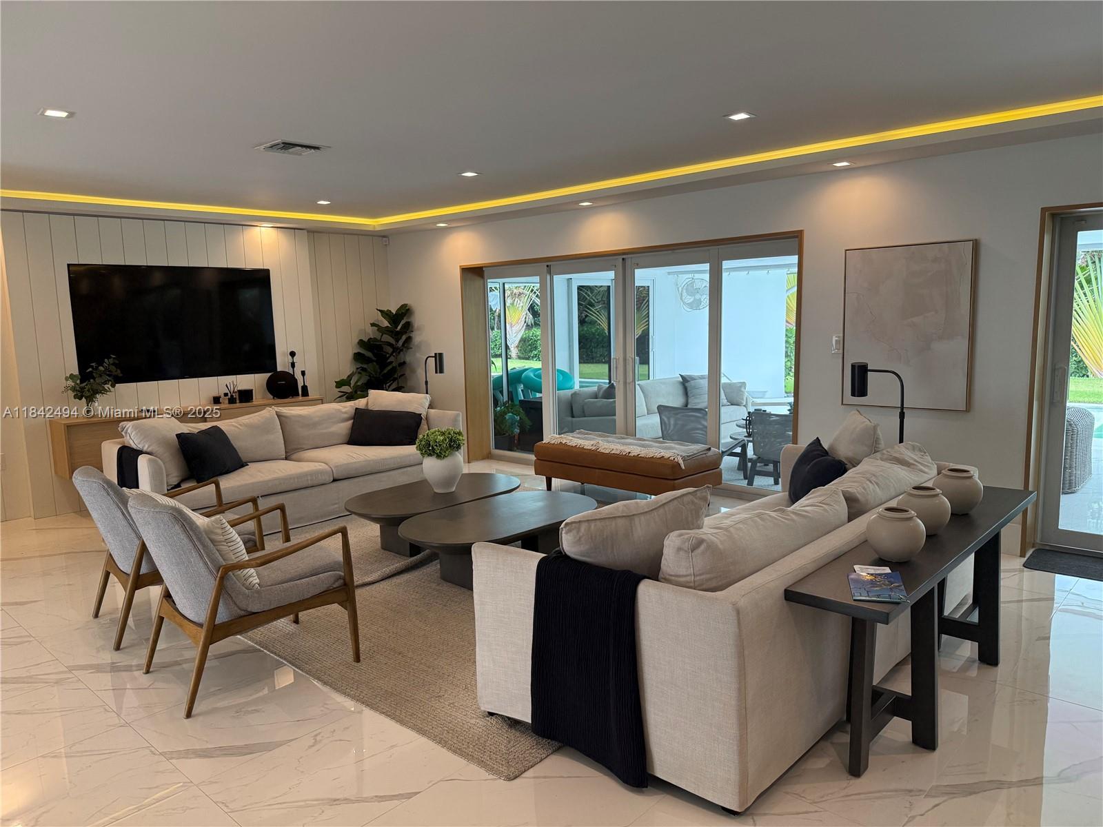 A 100% luxuriously renovated golf course home overlooking Shell Bay Golf and Country Club. A chic, open concept living with a bright kitchen and a huge island with seating for 6, opens to a spacious living and dining area with cove lighting wrapping around the entire room. Elegant foyer with storage cabinetry w/ luxurious wood panels, LED lit, stone wall. A split floor plan of 5 bedrooms plus 4.5 bathrooms, custom closets throughout, finest quality interior doors with hidden hinges. Gentle glide, impact sliders open to a 600 SF covered entertaining terrace, with panoramic views of the Greg Norman designed Golf course, (formerly Diplomat Golf Course). Elegantly staged for a dramatic showing. Minutes to Aventura, Bal Harbor and FLL. Diplomat Parkway is southeast Broward?s ?HAUTE' new area!