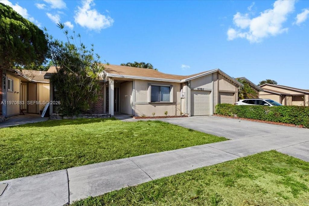 Photo of 9701 W Daffodil Ln #9701, Miramar, FL 33025 (MLS # A11970883)