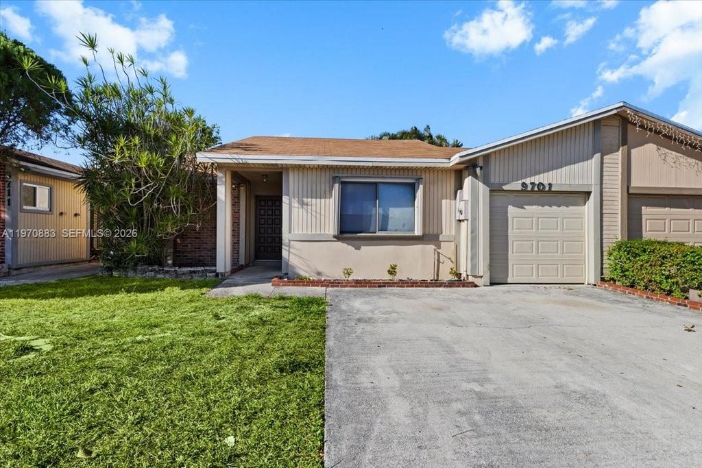 Photo of 9701 W Daffodil Ln #9701, Miramar, FL 33025 (MLS # A11970883)