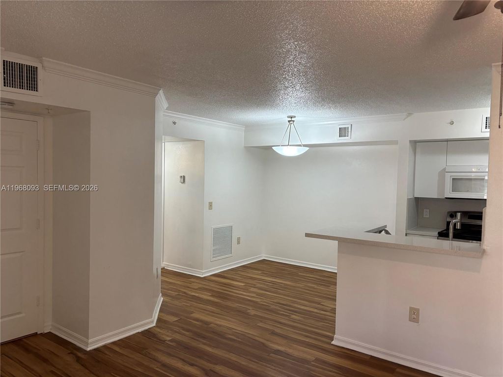 Photo of 2433 Centergate Dr #202, Miramar, FL 33025 (MLS # A11968093)