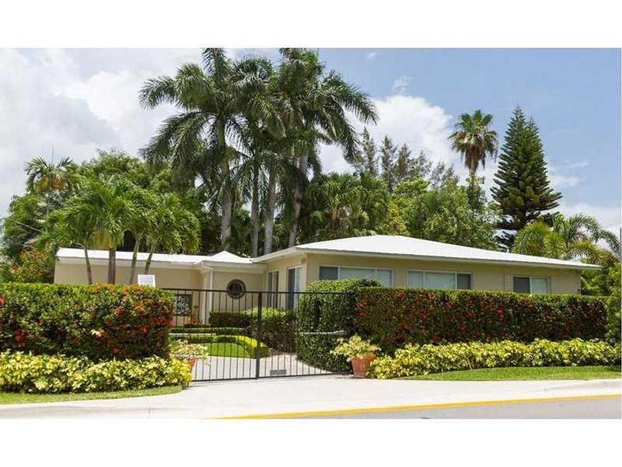 Absolutely charming Venetian Island home. Many upgrades (newer roof, generator, AC, windows, etc--- all done with permits). Large corner lot with lush landscaping.