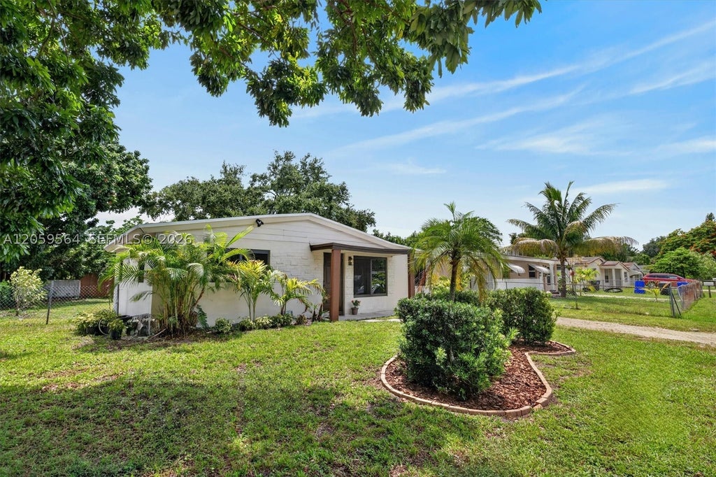 Photo of 5626 Raleigh St, Hollywood, FL 33021 (MLS # A12059564)