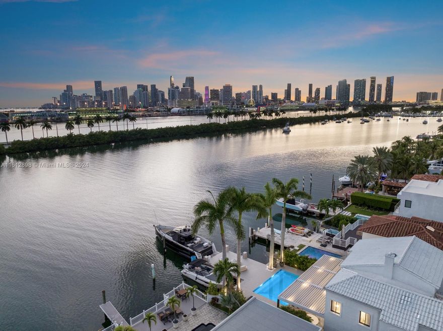 Welcome to Villa Bianca, a completely renovated waterfront residence thoughtfully curated by Artefacto. Located in the prestigious community of Palm Island, this turnkey, modern home is delivered with furniture and interior design by Fabio Morozini and Artefacto. The gourmet Italkraft kitchen features Wolf and Subzero appliances and Bronze Crystallo Countertops. Meticulously designed with a focus on modern aesthetics, this home has sleek lines, floor-to-ceiling windows, and an open floor plan with Nana sliding glass doors that invite you to the exterior. The backyard features an entertaining deck, saltwater negative-edge pool, two vessel dock on 50 ft of waterfrontage, and picturesque views of Downtown Miami.