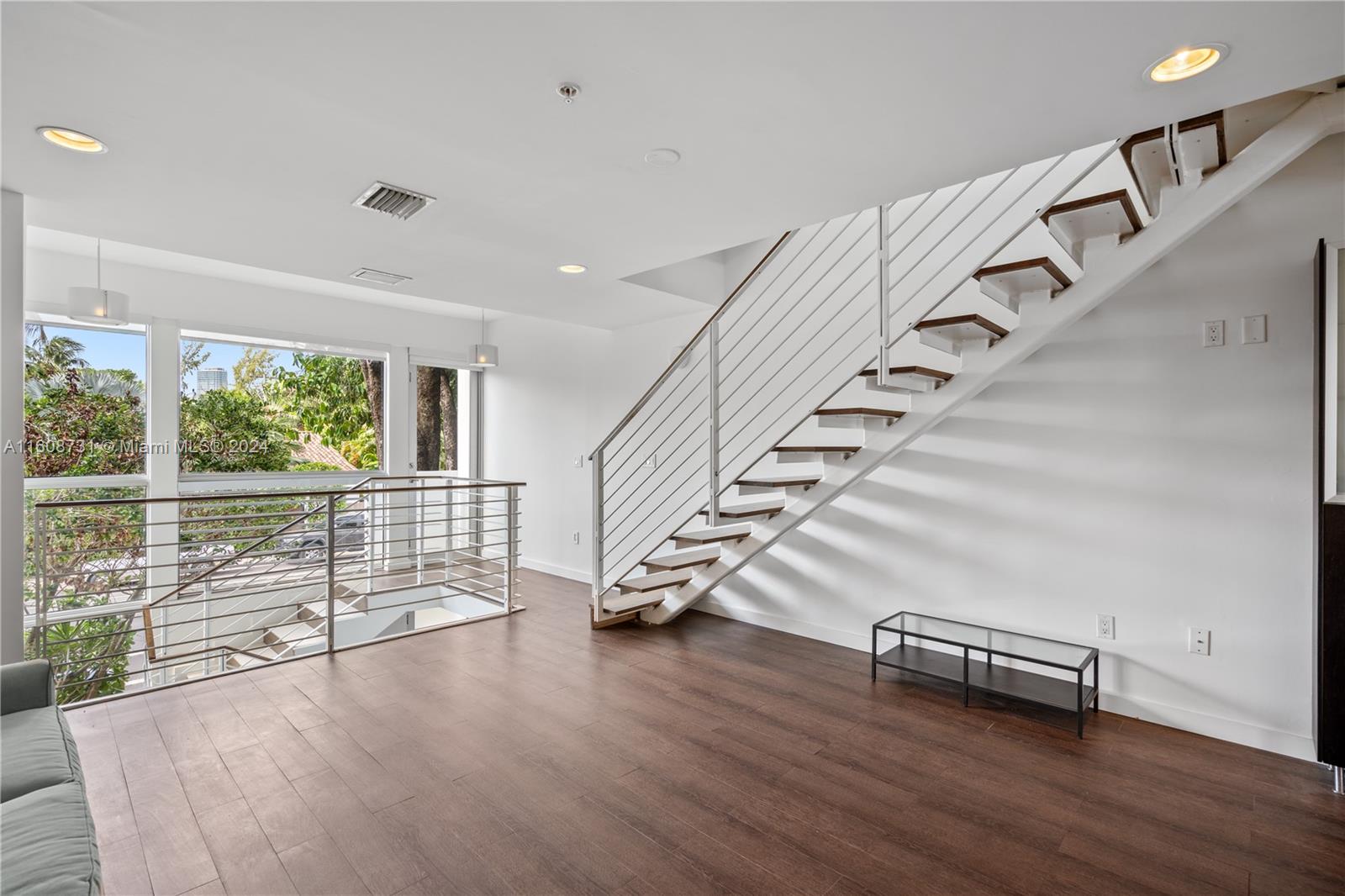 Absolutely exceptional! This luxury 3-story townhome near famous Lincoln Road mall offers a modern design, high ceilings, 2 BR, 2 elegant baths, and a glass-enclosed 3rd level bonus space perfect for a great office. Enjoy a private rooftop terrace with a spectacular view of Miami Beach, Enjoy unique private terraces one-of-a-kind features off every floor. The home includes 2 private covered parking spaces with gated entry. Don't miss the chance to own this magnificent residence conveniently located near shopping and the beach.