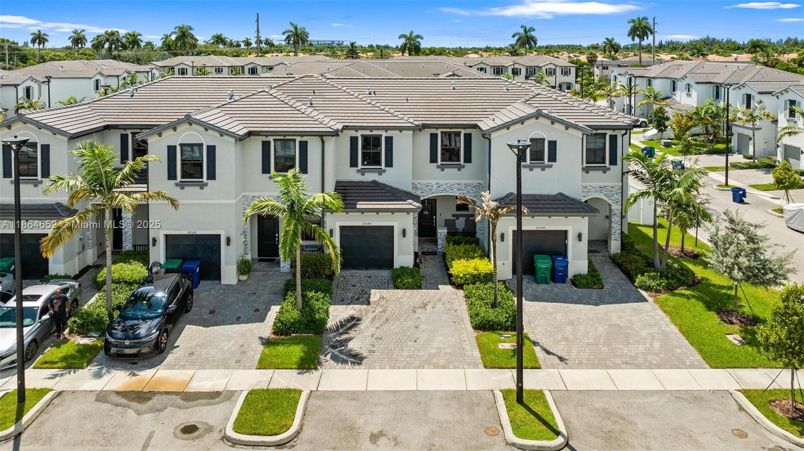 Stunning & spacious 3 bed/2.5 bath townhome located in Vista Lago, one of Miami's most exclusive gated communities. Upgraded tile throughout first floor. 1 car garage. Great chef's kitchen features tall cabinets & top-of-the line stainless steel appliances. Fiber OPTIC CABLE for maximum high speed internet. Washer & dryer. Vista Lago features resort-style amenities including a sparkling pool, fitness center, clubhouse, playground, guest parking, and 24/7 security. Ideally located near Hard Rock Stadium, parks, schools, shopping, dining, and with easy access to Florida’s Turnpike, US-441, and I-95. Perfect for families, professionals, or investors looking for a low-maintenance lifestyle in a thriving community. This home is a must-see!