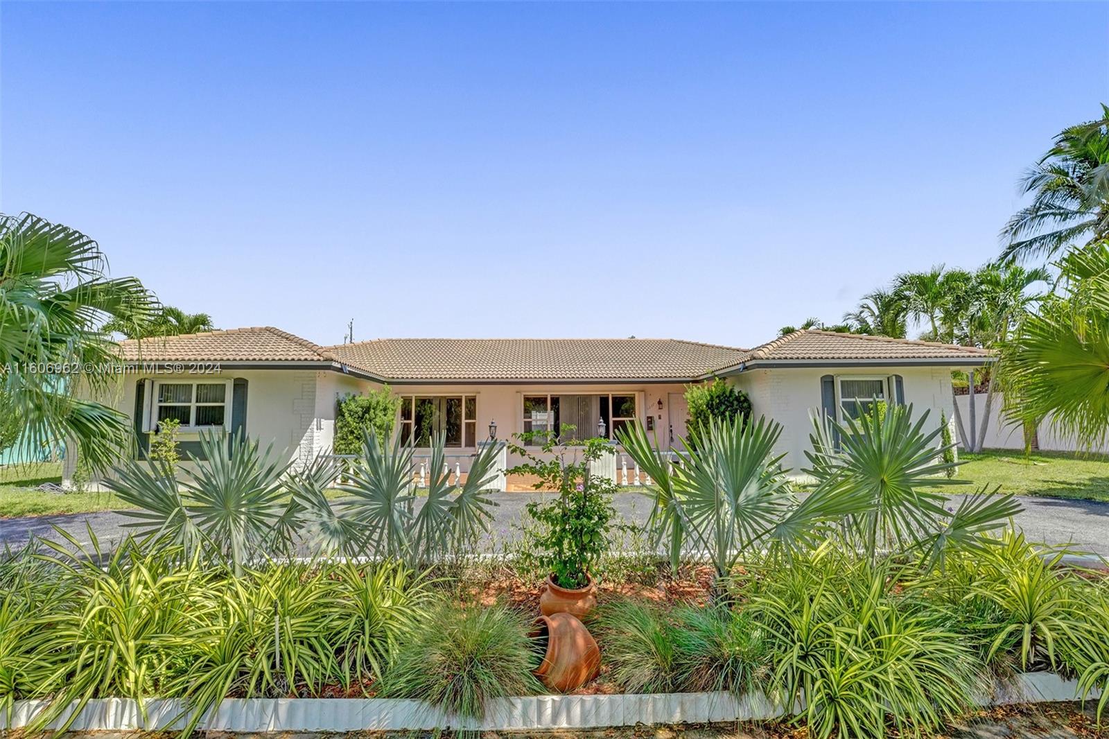 A spacious ranch style 5 bedroom, 3 bath home, 2 car garage, across the street from the most state of the art golf course! THIS HOME HAS NOT FLOODED. An incredible front porch. Lots of living space, oversized family room, located on a double lot with over 14,000 SQFT. Ample room to build an amazing pool. Conveniently located close to the beach, steps from Diplomat Pkwy, downtown Hollywood, Gulfstream Stream Village & short drive to the Beach. The opportunity on this home is endless!