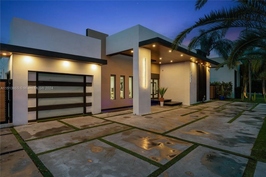 KEYSTONE POINT NEW MODERN 2019 REMODEL* DIRECT OCEAN ACCESS *OVERSIZED 78' WIDE LOT* 60' OF SEADECK FLOORING IN NEW DEEPWATER DOCKAGE*DIRECT OCEAN ACCESS* 4BDRS|4BATHS| POOL/JACUZZI |2700 SF| Immerse yourself in the heated saltwater custom pool, complemented by a jacuzzi for 8. The property also includes a Neptune boatlift up to 33000 lbs. Keystone flooring adorns the outdoor terrace, providing an elegant touch as well as everything else on this home that is new from the roof to the plumbing system. Enjoy peace of mind with an 8-channel security system. Located just minutes from the open bay with no fixed bridges, this residence offers unparalleled access to the waterways. The high façade is a sight to behold, featuring a waterfall and water mirror, a true sign of serenity and modernism.