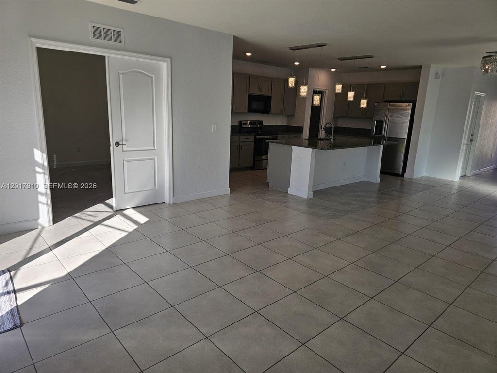 Photo of 831 Bent Creek Dr, Fort Pierce, FL 34947 (MLS # A12017810)