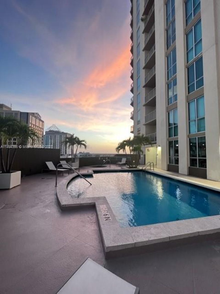 MAJESTIC Loft unit with enclosed bedroom in the LUXURIOUS METROPLIS TOWER. Unit has 1 Bedroom/1 Bath, 14’ ceilings, huge walk-in closet, Tile in Kitchen and Bathroom, Carpet in the bedroom and living room, granite countertops, modern kitchen cabinets, stainless steel appliances, washer/dryer in unit. 
Building offers 2 pools, jacuzzi, gym, spa, recreation room, 24 hr Security, front desk concierge. 
AMAZING LOCATION – across from Metrorail, Dadeland Mall, Publix, Trader Joe’s, Dining, Shopping & Entertainment. No Pets,No Smoking. Water, Basic Cable included in rent. 1 assigned parking spot. Valet is available.