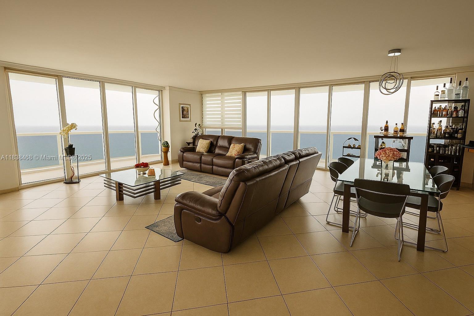 Experience luxury oceanfront living in this fully renovated high-rise apartment with breathtaking panoramic views. Floor-to-ceiling windows surround the open-concept living space, filling the home with natural light and endless ocean vistas. The expansive wrap-around balcony is perfect for entertaining or relaxing, while the spa-inspired primary bath features a Jacuzzi tub and sleek indoor shower. Modern finishes, a gourmet kitchen, and seamless indoor-outdoor flow create an elevated yet comfortable atmosphere. Enjoy resort-style amenities including 24-hour security and valet, five heated pools, an oceanfront spa, fully equipped fitness center, and private beach access. This is coastal living at its finest—where every day feels like a vacation.