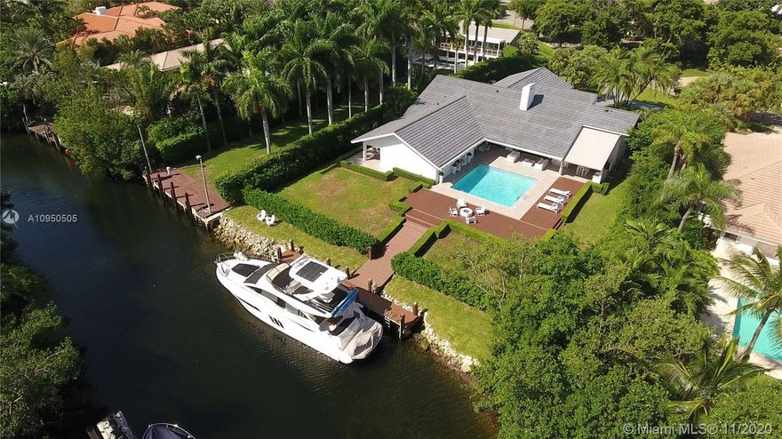 Beautiful waterfront home on a 27,908 sqft lot located in the coveted & gated Cocoplum. Gracious floor plan features living & dining rm that open to the outdoor terrace & pool area. Large eat-in kitchen, separate laundry rm & huge family rm w/balcony. The main suite overlooks the pool area & features a walk-in closet, spacious bath w/it's own private terrace. There are 2 additional bedrms each one w/a bathrm in this wing. The other wing includes an office, guest bedrm w/it's own bath & a full cabana bath leading to the pool area. Enjoy the outdoors w/a spacious covered terrace, outdoor kitchen & bar, pool & dock. This property has a 114 ft waterfront w/ocean access. 2-car garage w/custom cabinets. New roof & impact windows and doors installed in 2019. Cocoplum Sec 1 is special tax district