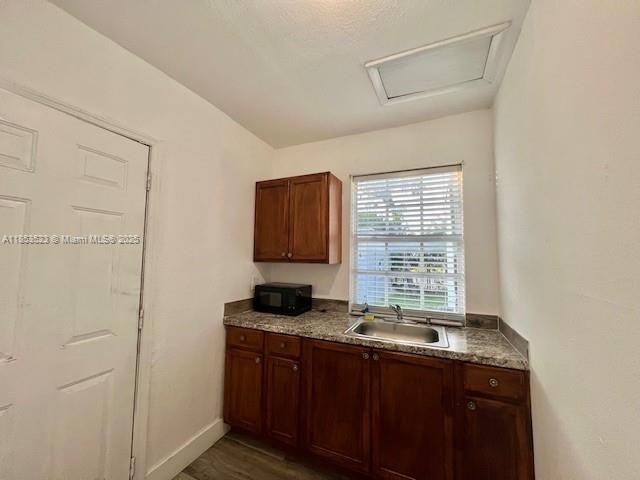 Large Studio with NO STOVE in the Rear of the property freshly painted and ready for immediate occupancy right in the heart of Miami. Amazing location close to Orchard Villa elementary school, shopping, public transportation, MIA Intl Airport, Buena Vista, Allapattah, Wynwood, Shops at Midtown and much more. There are 2 other units in the back a detached unit and the front an attached unit to this property. Tenants to share driveway, walkway and the front and backyard. Utilities are not included
