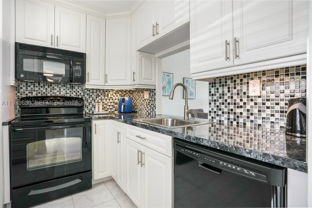 Photo of 4801 NW 34th St #406, Lauderdale Lakes, FL 33319 (MLS # A11939580)