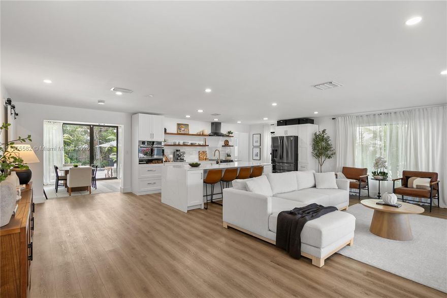 Completely Remodeled Coastal Gem – Walk to the Beach! This stunning 4-beds 3-bath home has been fully upgraded with high-quality finishes and approved renovations. Brand-new plumbing, electrical, HVAC, and impact windows/doors, all designed with a sleek modern touch. Open layout with stylish kitchen, waterfall island, quartz countertops, and premium appliances, seamlessly connecting to bright living and dining areas. Master suite offers a spa-like bath and a walk-in closet. Prime location on Hollywood Blvd, just a few blocks from the beach and Downtown Hollywood! Only 10 minutes from Aventura Mall, Sunny Isles Beach, top restaurants, and shopping. No HOA or rental restrictions—perfect for homeowners or investors. The fenced backyard offers privacy and a great space to relax or entertain.