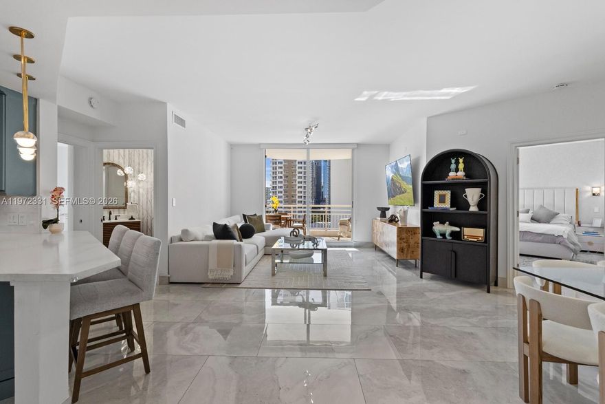 Fully renovated 2-bedroom, 2.5-bath residence featuring a bright and spacious open layout with elegant porcelain tile flooring throughout. Modern kitchen with sleek cabinetry, quartz countertops, stainless steel appliances and ample storage.
The unit includes new A/C, water heater,  refrigerator and new microwave.
Spacious primary suite and second bedroom with beautifully updated bathrooms showcasing contemporary finishes. Washer and dryer inside the unit.
Enjoy a  private balcony with open city views, perfect for outdoor dining and relaxing.
Parking includes one assigned garage space plus tandem parking for a second vehicle.
Building amenities include pool, jacuzzi, fully equipped fitness center, business center and event/party room.