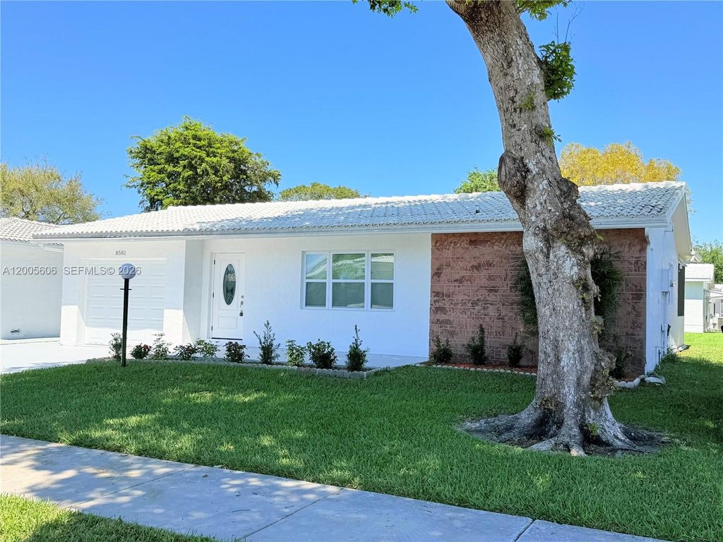 Photo of 8581 NW 17th St, Plantation, FL 33322 (MLS # A12005606)