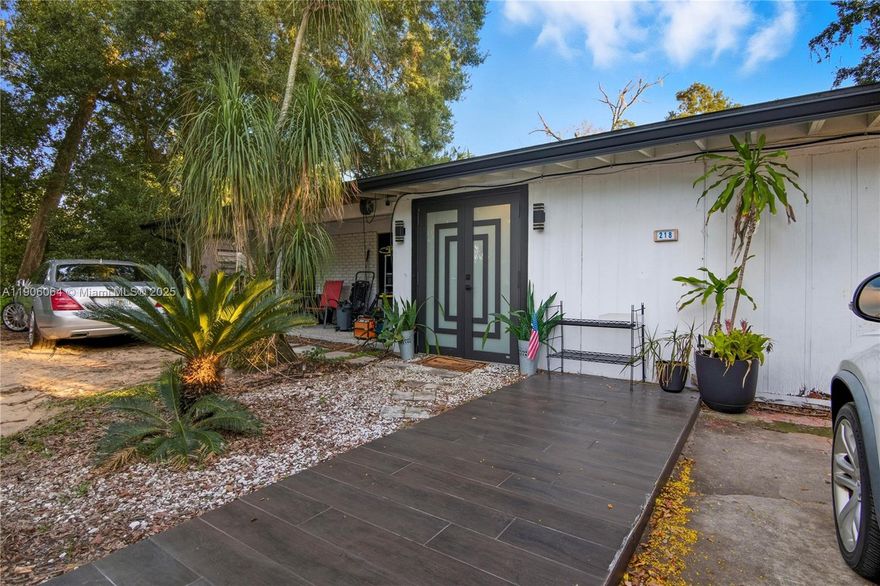 This stunning property offers 2,018 sqft of spacious living with 5 bedrooms and 3 bathrooms, perfect for families or entertaining. Enjoy luxurious porcelain floors, updated in 2023, throughout almost the entire home. The roof was completely remodeled in 2021, ensuring peace of mind. Safety meets style with new impact-resistant doors and windows. The fully equipped exterior kitchen is perfect for alfresco dining and summer gatherings by the pool. Surrounded by durable PVC fencing and featuring a concrete wall in the backyard, this home provides privacy and security. Conveniently located just minutes from: Florida Mall: 2.5 miles, Orlando International Airport: 6.5 miles, Universal Epic: 5 miles, Universal Studios: 6.3 miles, Hospitals: 3 Miles and a lot more, schedule your showing today!