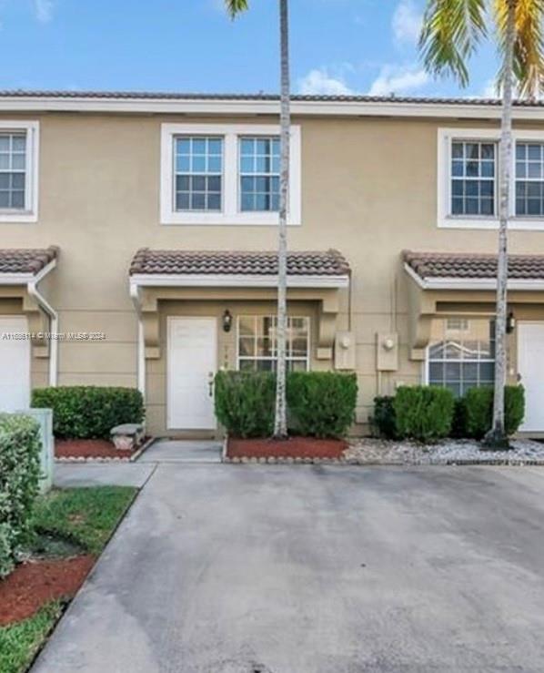 Discover this fantastic 2 Bedroom , 2.5 bathroom townhouse located in the desirable Pelican Pointe community in Pembroke Pines.This well maintained unit features a washer dryer for your convenience and offers a spacious second bedroom with a en-suite bathroom.Tile on the first floor, vinyl on the second floor.Enjoy the added convenience of a half bathroom (powder room) on the first floor. You'll have two dedicated parking spaces right in front of your townhouse, The community boasts excellent amenities. The spacious townhome includes a screened in patio and a backyard space with a turf yard to enjoy.
