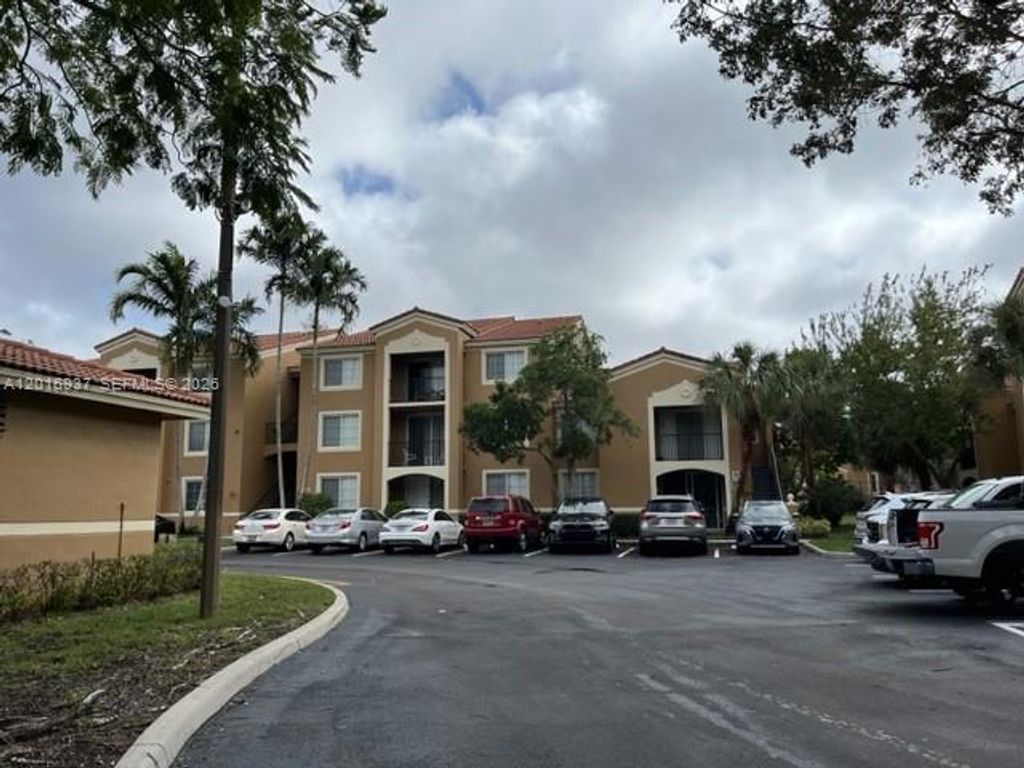 Photo of 8000 N Nob Hill Rd #206, Tamarac, FL 33321 (MLS # A12016937)