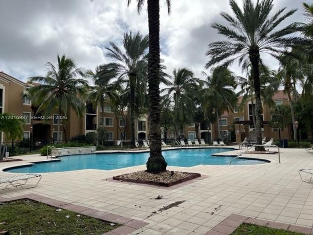 Photo of 8000 N Nob Hill Rd #206, Tamarac, FL 33321 (MLS # A12016937)
