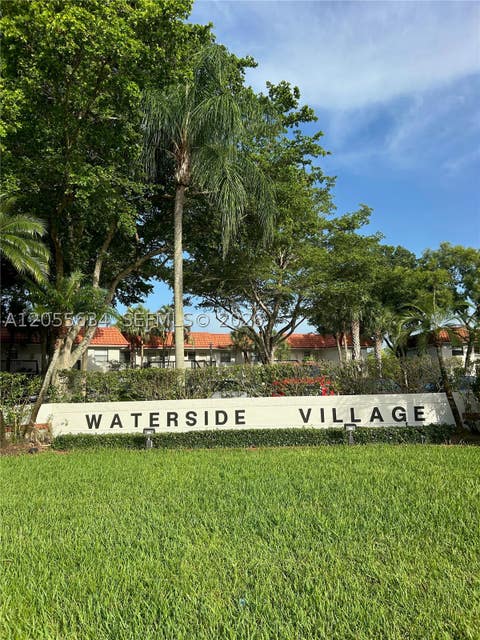 Photo of 15710 E Waterside Cir #203, Sunrise, FL 33326 (MLS # A12055634)