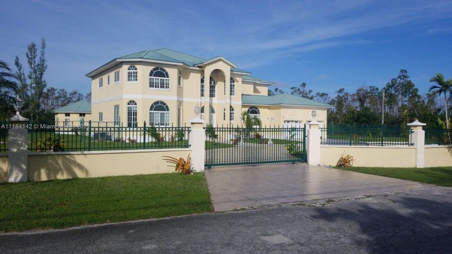 Furnished 5/5 1/2 5000 sq ft with Swimming pool, completely enclosed and gated home. Once pass gate, drive around circular driveway as the waterfall welcomes you. Cedar Ceiling embraces from entrance to get a true island feel. Come through unique tropically etched French doors. 30ft high cedar ceilings greet you as you enter and throughout with Chandeliers and high hat lights. Pass through the foyer gold/platinum columns to get to your tranquil oasis. Dining room has etched french doors, crown molding surrounds ceiling giving a spectacular view of the pool. Intercom system throughout. Master bed has upgraded gold faucets, dual marble sinks, other bathrooms have corian countertops, Lucayan International School 2 miles away for Elementary, Middle and High School.