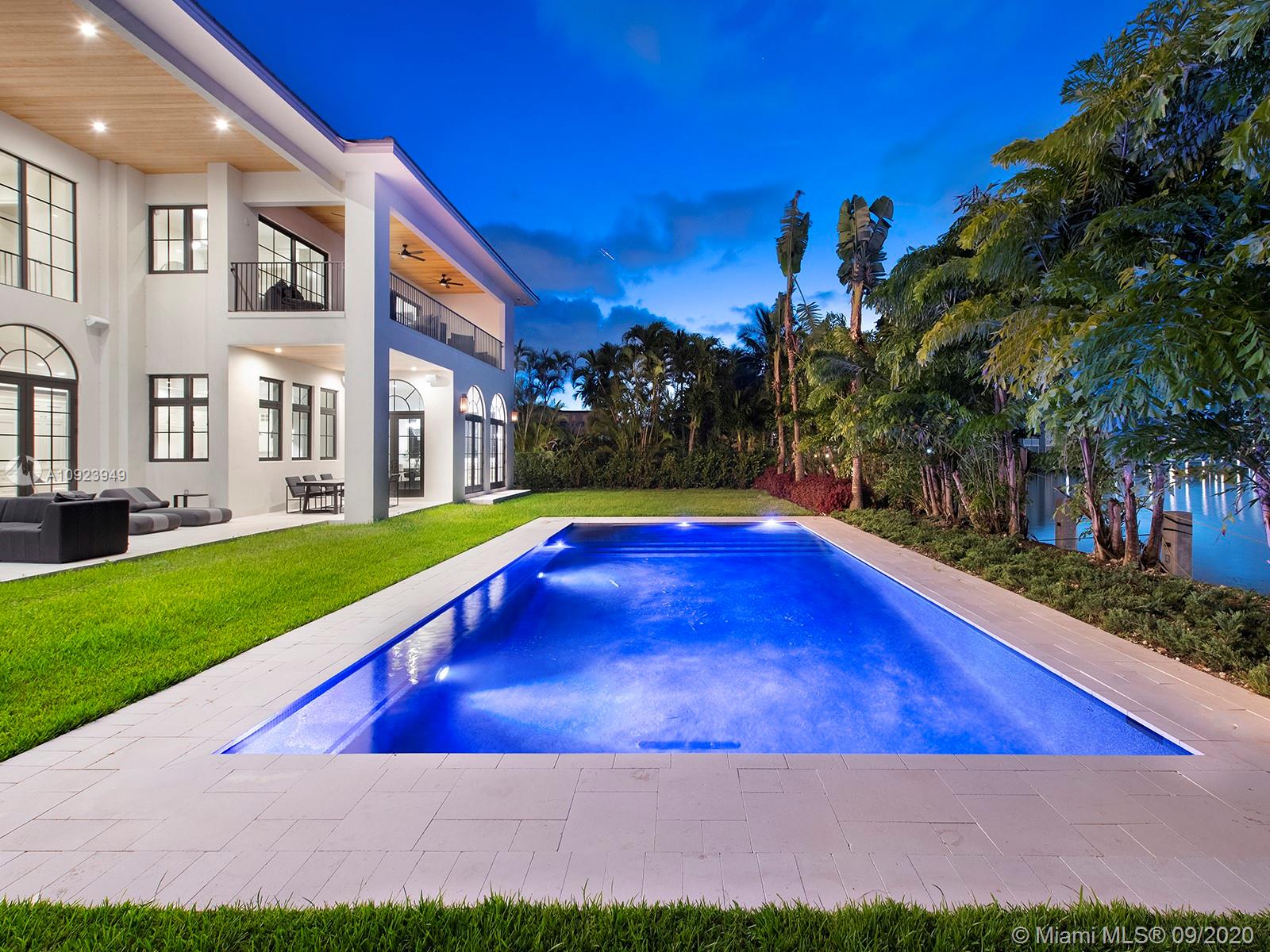 Located in the exclusive Golden Isles community, this architecturally stunning waterfront home displays exquisite craftsmanship, sophistication, & thoughtful details throughout w/ no expense spared. This Mediterranean-inspired home seamlessly combines traditional w/ a modern twist creating a balance that boasts comfort, light, & warmth. Offering 5 bedrooms, unique custom baths, office, study den, playroom, private maid quarters, 2 laundry rooms, & more! Amenities include elegant curved windows, tasteful wood + marble flooring, grand Ralph Lauren & Julie Neill chandeliers, a chef's kitchen equipped with La Cornue Chateau series range, Downsview cabinetry, & Sub-Zero Wolf wine fridges + dual beverage drawers, & deluxe Waterworks fixtures. Enjoy 112 FT on a wide canal & luxury living in SoFL