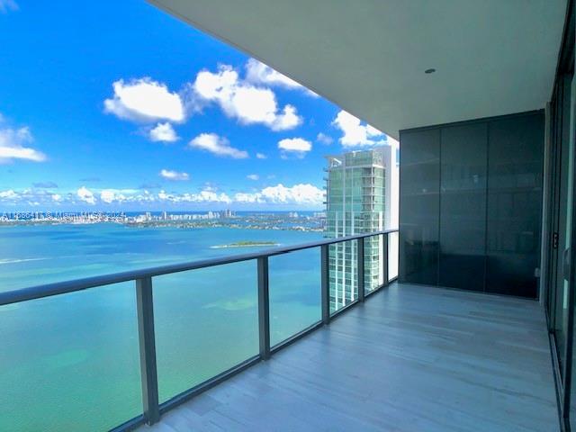 Breathtaking flow through 3 bedrooms & 3 bathrooms + Den waterfront unit with private elevator and private foyer and TWO PARKING SPACES ASSIGNED. This spectacular unit features beautiful and modern flooring with wrap-around balcony. Shades in all the common spaces and blackouts in bedrooms. Built-in closets in all bedrooms. Enjoy a stunning water view from the 46th floor. Gran Paraiso is an amazing development in Edgewater with 5-star amenities such as lobby attended 24-hours, valet, parking, state-of-the-art fitness center, Tennis courts, children playground, spa, game room, bowling alleys, and walking distance to design district and Wynwood. EV Charge available in the condominium. Rented until Oct 2025.