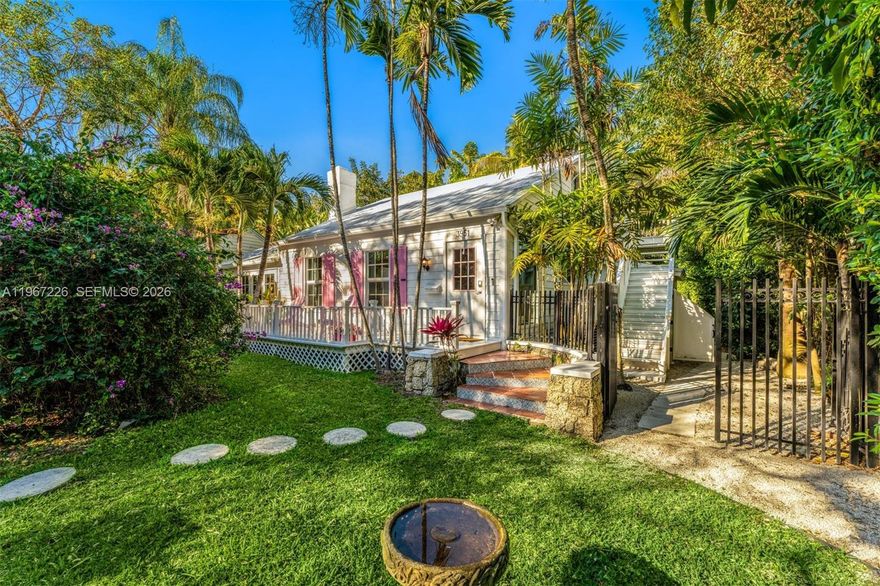 Welcome to the most charming cottage in Coconut Grove! Perfectly tucked away on a unique and picturesque one-way street, this beautifully updated gem set within a coral rock wall blends timeless character with thoughtful modern upgrades. The main residence features a stylish kitchen appointed with Viking stainless steel appliances, along with a spacious one-bedroom layout and an oversized spa-inspired bath complete with a steam shower and separate soaking tub for ultimate relaxation. A sun-filled Florida room offers the perfect space for a home office, play room, reading nook, or cozy lounge, all bathed in natural light throughout the day. Upstairs, accessed through an external staircase, a private studio with its own full bath provides exceptional flexibility for guests, a creative retreat, or a dedicated workspace. Step outside to your own tranquil oasis featuring a lush, private yard centered around a generous entertaining deck, hot tub, cold plunge, and outdoor shower. This serene retreat is set in one of Miami’s most sought-after neighborhoods, just moments from the vibrant Grove village where you can walk or bike to boutique shops, dining, marinas, and scenic waterfront parks and within minutes to the most reputable schools in Miami.