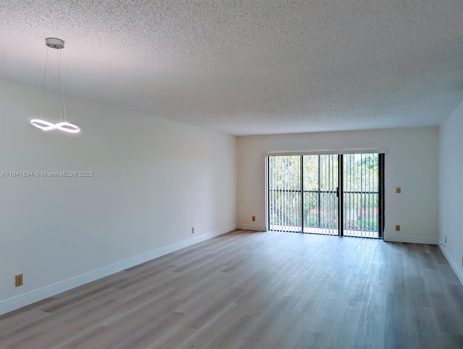 Beautifully updated apartment, freshly painted, the home features brand-new laminate flooring elegant bathrooms. 2 spacious bedrooms and 2 bathrooms, big closets, this home is designed for both comfort and style. Big screen balcony provides additional living space. Serene view to the garden and indirect lake, creating a stunning for relaxation. Offer a storage and 1 parking, while the Bonaventure clubhouse boasts a large gym and a variety of top-tier amenities. The best schools in the area. The association fee included: Water service, waste, maintenance of common areas, roof care, Lanscaping & Pool. Additional enjoy the Bonaventure club