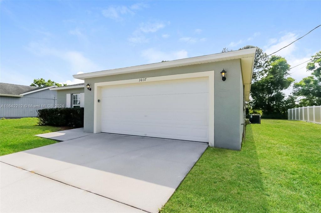 Photo of 3037 SW Ann Arbor Rd, Port Saint Lucie, FL 34953 (MLS # A11642212)