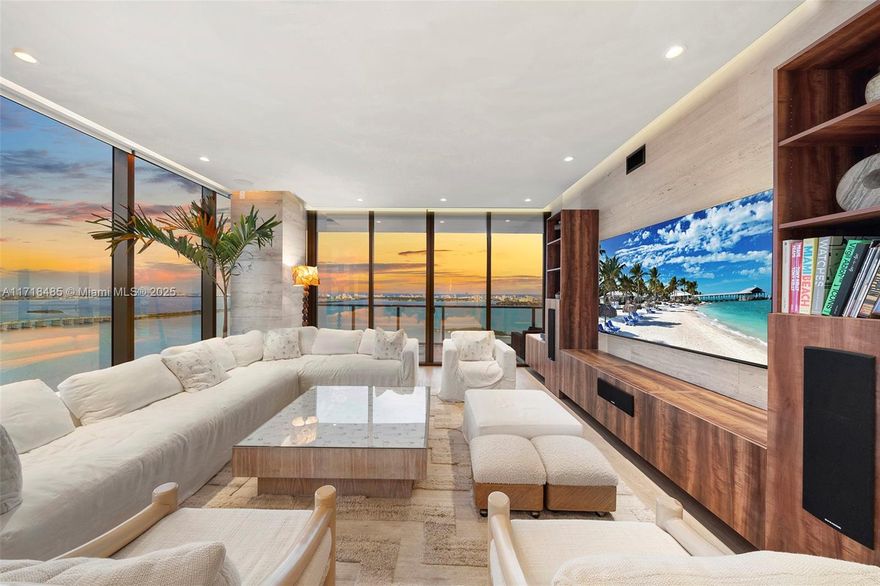 Ultimate luxury in the sky. Spanning half of the 35th floor with an east-to-west flow through design, this residence boasts breathtaking unobstructed water views across the Bay and skyline. Every inch of this home has been professionally customized with ultra luxury finishes. Travertine-wrapped walls and imported Italian wood floors throughout. The chef’s kitchen is equipped with premium Wolf and Taj Mahal quartzite countertops. The primary suite features a massive closet and a spa-inspired bathroom carved out of Rosa Cristallo quartzite. Entertain in style with your Patagonia granite accent wall, wet bar and built-in AV system. The smart controlled home has Lutron lighting, Somfy shades, and a fully integrated JoshAI system. Enjoy 5 star amenities including two pools, a spa, gym and more.