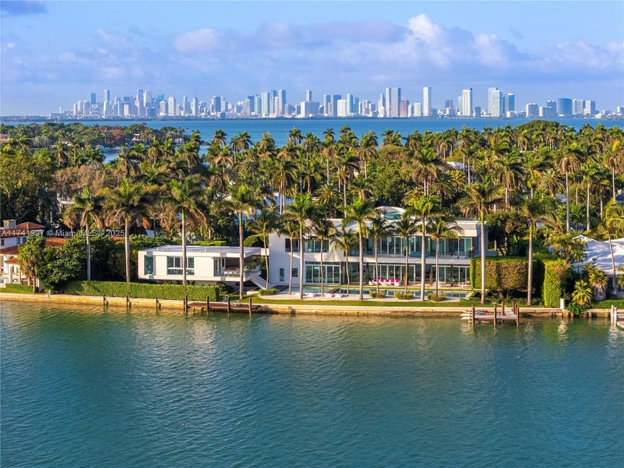 Welcome to OKTO, an extraordinary waterfront estate with striking contemporary design on guard-gated La Gorce Island – currently, largest available single-family home in Miami Beach! Sited on exquisitely manicured, 1.1-acre (48,027-sf) lot with 260-ft waterfront, this lavish mega-mansion has been meticulously maintained. Grand entrance leads inside the main house featuring a 100-ft long living room with soaring ceilings, Guggenheim-inspired staircase with skylight, & water views. Chef’s kitchen, formal dining, and gym on 1st floor; upstairs, entertainment room, opulent master suite with immense closet, deluxe bath, terrace, and 4 beds. Amenities include 2 docks, 100-ft pool, rooftop, elevator, guesthouse, 5-car gar, 2-bed staff quarters. Absolutely astounding, ideal for a discerning buyer.