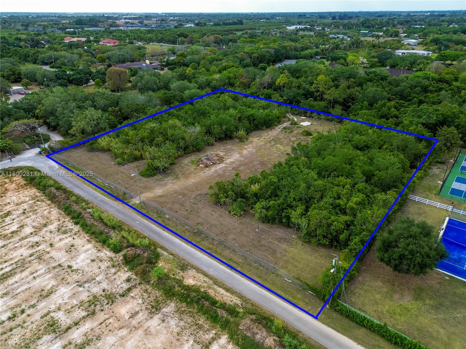 Rare opportunity to own 2.237 acres in Miami-Dade’s AU-9000 agricultural zone. This fully fenced lot features gated access on the south side and offers privacy and flexibility for rural living or agricultural use. Approximately 2.0 acres are designated as Natural Forest Community, preserving native vegetation and supporting a peaceful, eco-friendly lifestyle. No utilities on site; electric is available at the street. No well or water connection currently available. Ideal for building a custom home or enjoying as a private recreational retreat. Surrounded by nature, yet within reach of Miami-Dade conveniences, this land is perfect for those seeking space, seclusion, and potential.