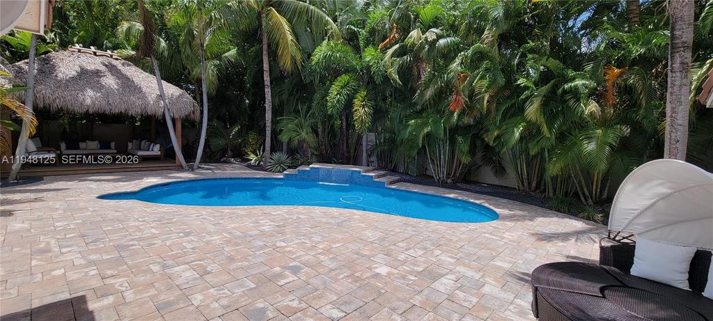 Photo of 423 NW 48th Ave, Deerfield Beach, FL 33442 (MLS # A11948125)