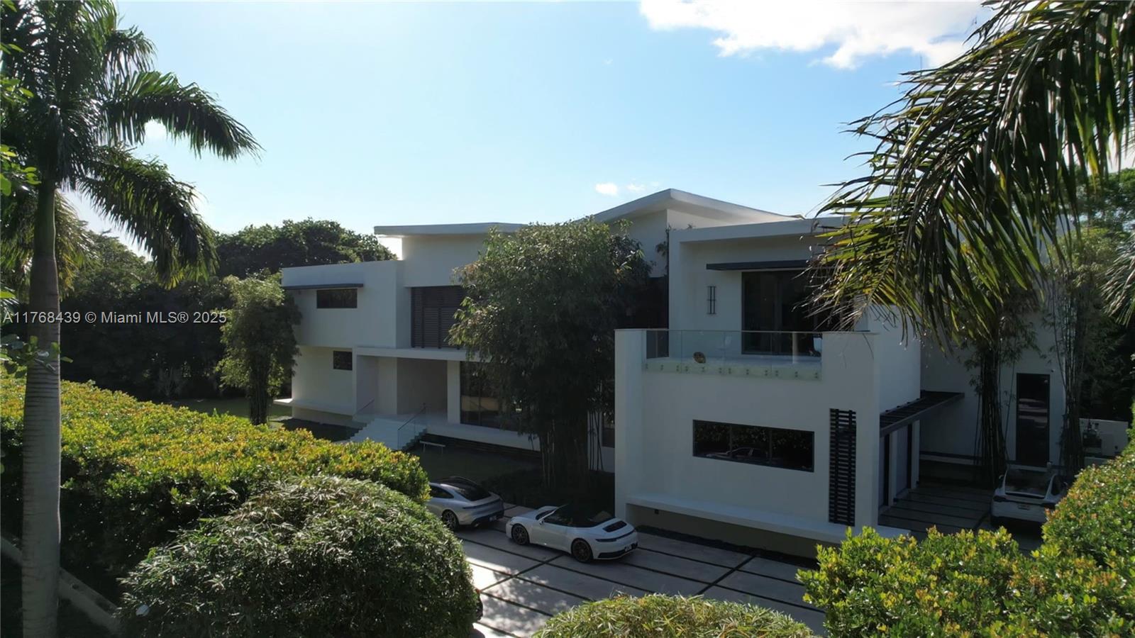 Designed by renowned architect Alberto Cordovez, this modern luxury home sits on a sprawling acre lot in the prestigious Ponce Davis neighborhood. With over 12,000 sq ft of meticulously crafted space, the custom-built residence features high-end finishes, including wood paneling, limestone floors, and a state-of-the-art kitchen equipped with Wolf appliances and a 200 bottle capacity wine cellar. The outdoor area is highlighted by a stunning 40x15 infinity pool, while a fully equipped gym and a three-car garage with potential for lifts add even more convenience. Smart home automation ensures seamless control of lighting, climate, and security, providing the ultimate in modern living.