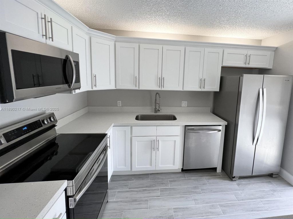 Photo of 1415 14th Ct, Palm Beach Gardens, FL 33410 (MLS # A11890217)