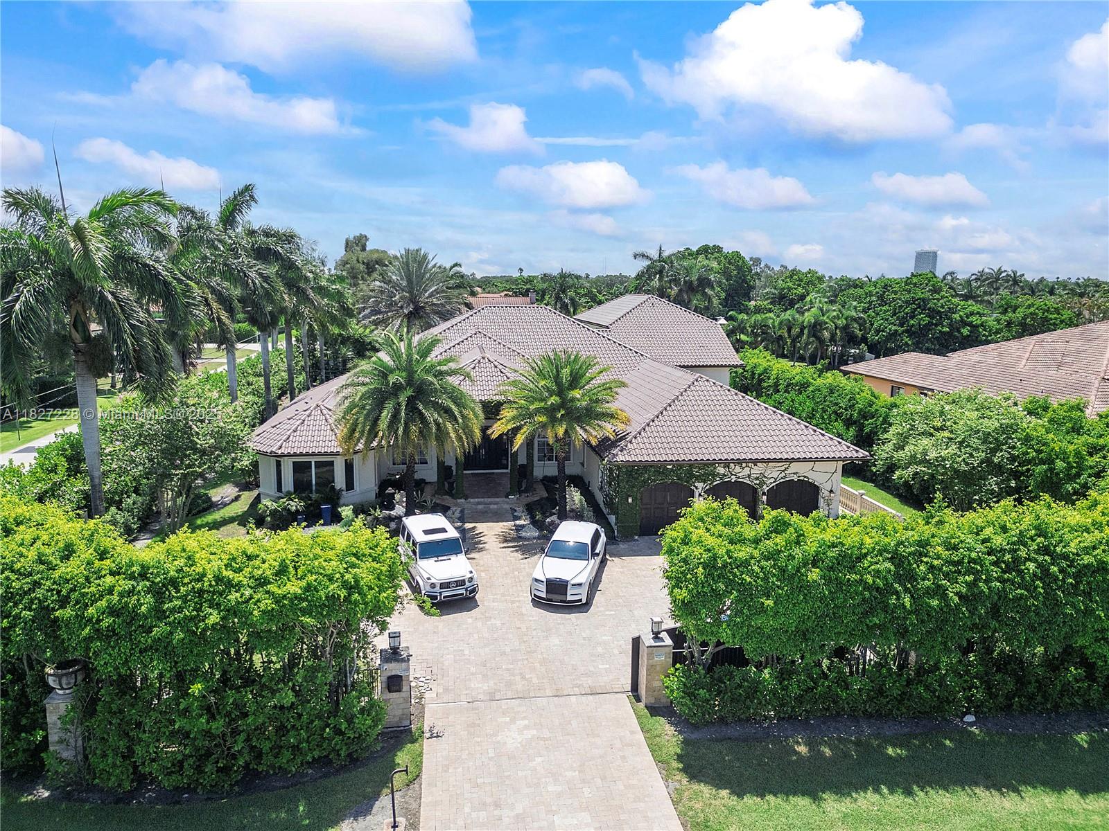 Welcome to your private resort-style retreat in Plantation Acres! This fully updated estate offers 5 spacious bedrooms, 4.5 luxurious bathrooms, and high ceilings throughout. Enjoy a dedicated movie room, home gym, and a large in-law suite with its own kitchen and full bath. Step outside to an oversized pool, basketball court, and private mini putt-putt course, all surrounded by lush landscaping and total privacy. The property features a gated entrance and full camera security system for peace of mind. Located in one of Plantation’s most desirable neighborhoods, with no HOA restrictions, this home provides the freedom and space you’ve been searching for. Experience the ultimate South Florida lifestyle.