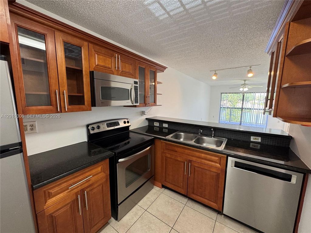 Photo of 9893 Nob Hill Ln #9893, Sunrise, FL 33351 (MLS # A12015306)