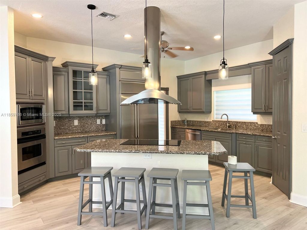 Photo of 8160 NW 47th Dr, Coral Springs, FL 33067 (MLS # A11859766)