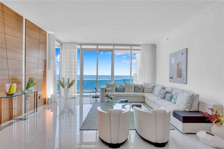 L-PH 03 greets you from the private elevator foyer to a gorgeous direct ocean view. The balcony fits a 6-person dining table & 2 chaise lounge chairs. It spans the length of the East side of the home w/ access from the primary bedroom & living rm. This renovated home has large white glass tile floors & an open flow thru room floor plan with East & West exposures. The brand-new gourmet kitchen has a center island & eat-in seating, highend appliances & custom Italian cabinetry. The lg oceanfront primary bdrm features 2 walk-in closets, 2 hall closets, direct access to the oceanfront terrace, a large primary bath w/ 2 water closets, a double sink, a walk-in shower & spa tub. 1 tandem parking sp fits 2 cars. Sold fully furnished. See attachments