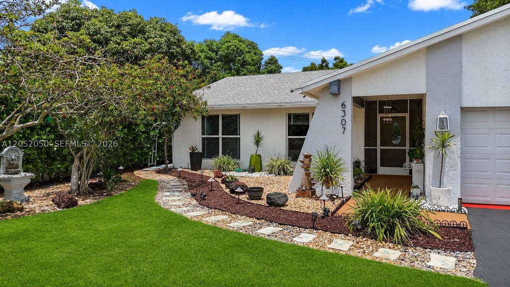 Photo of 6307 Silk Oak Cir, Tamarac, FL 33319 (MLS # A12052050)