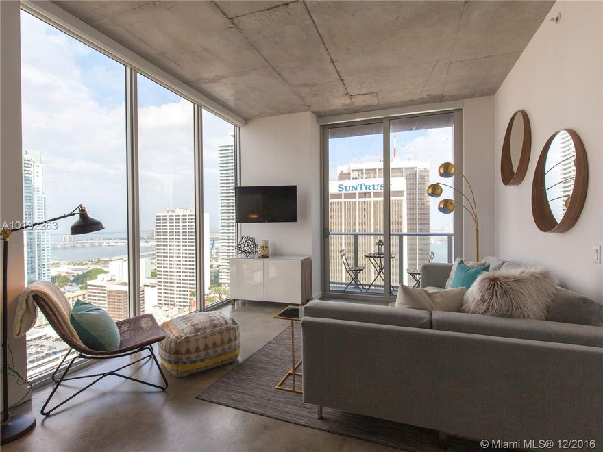 Impeccably furnished, never lived in large 1 BR corner unit at CENTRO - centrally located in downtown Miami. Breathtaking NE views, floor to ceiling windows with custom shades throughout the unit. Enjoy all the amenities that CENTRO has to offer; 24 hr lobby/security attendant, roof top pool & gym, cable & wifi included, walking distance to the bay, parks, Brickell City Centre and the people mover. Don’t miss out!!!  Short term rental available