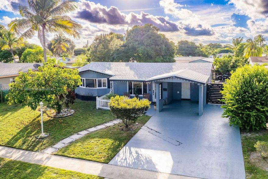 Nestled on a beautiful tree-lined street, this elegant single-family home offers the perfect blend of style, comfort, & location. Just minutes from the beaches, airports, Downtown Fort Lauderdale, & the Sawgrass Mills Mall. The home features a 4-car driveway & a covered carport. The front yard is beautifully landscaped with palm trees, while the soffits are enhanced with dimmable LED lighting. Major updates include a new roof & a new AC system, Vinyl wood flooring throughout, freshly painted interiors, & a bright, open floor plan. The modern kitchen has quartz countertops, stylish cabinetry that complements the flooring, & appliances for a sleek & functional cooking space. The backyard has a mature fruit tree. The paved area offers ample room for a BBQ grill & outdoor entertaining.