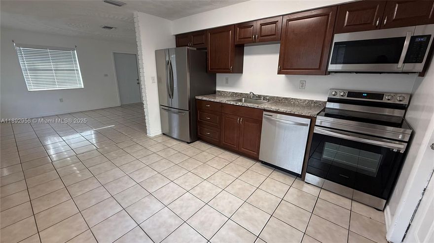 Refreshed and ready for immediate move in, this large 2 bedroom 1 full bathroom has newer appliances and a washer & dryer inside, parking for at least 2 cars. Conveniently located between the Turnpike & I-95, for easy commuting, minutes from Hard Rock Stadium, Gulfstream Horse track, downtown Hollywood and the Park at Young Circle where many festivals, concerts and leisurely activities are hosted plus Restaurants, Shopping and the beaches. Must see to appreciate, Fast approval, inquire today!
