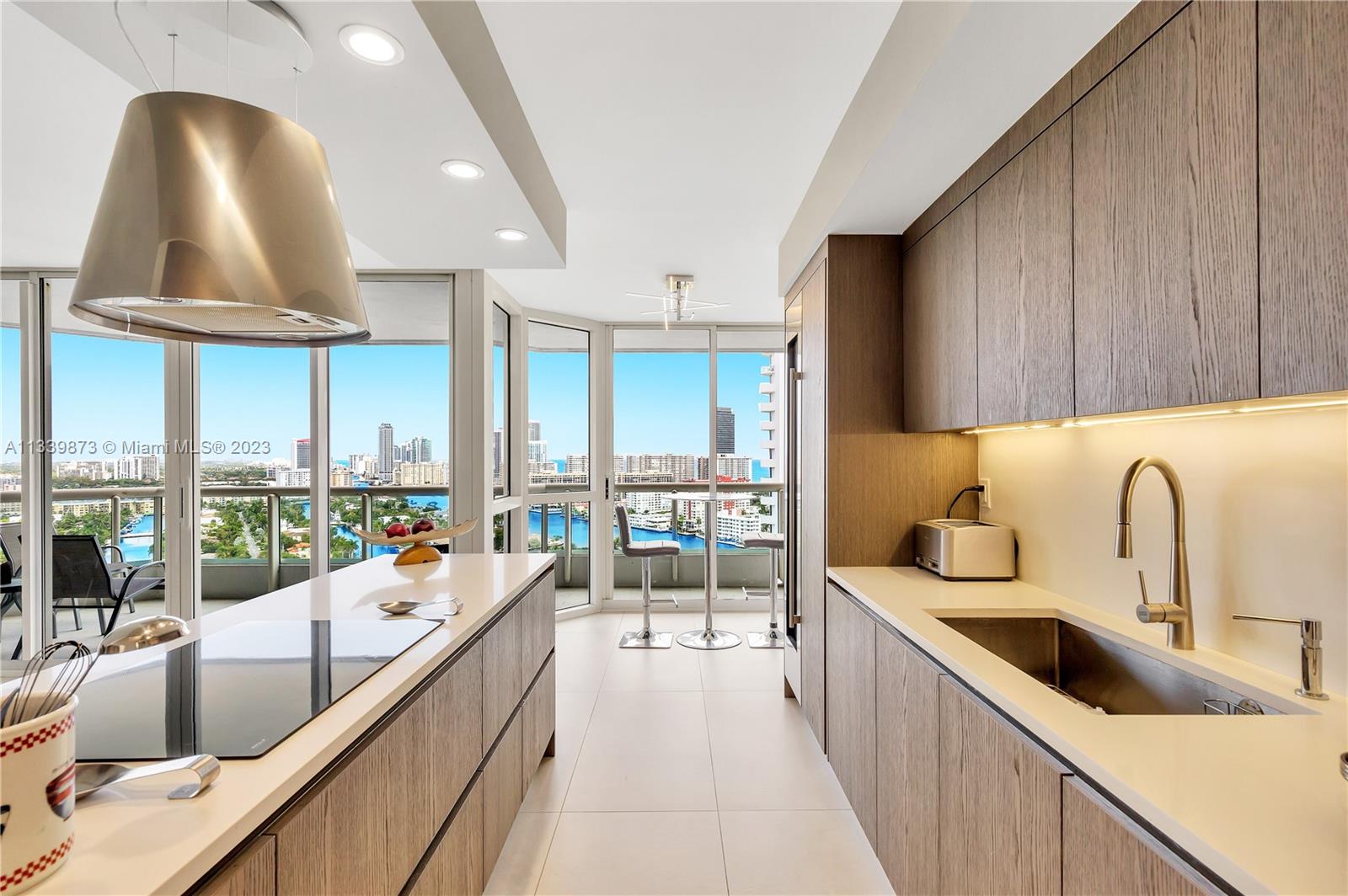 COMPLETELY RENOVATED 2 BEDROOM + DEN UNIT WITH A MAGNIFICENT INTRACOASTAL AND OCEAN VIEWS FROM THE ENTIRE APARTMENT. NO EXPENSE WAS SPARED. BEAUTIFUL RECENTLY INSTALLED OVERSIZED 48" X 24" ITALIAN TILE FLOORS, SMOOTH CEILINGS, RENOVATED BATHROOMS, TOP OF THE LINE APPLIANCES, SUBZERO REFRIGERATOR AND WINE STORAGE, WOLF WALL DOUBLE OVEN AND INDUCTION COOKTOP, EXTRA LARGE WASHER AND DRYER, NEW A/C UNIT AND WATER HEATER. EXPERIENCE RESORT-STYLE LIVING IN THIS BEAUTIFUL COMMUNITY WITH UNPARALLELED AMENITIES INCLUDING 25,000 SF CLUB AND SPA, MODERN FITNESS CENTER, 3 POOLS, 4 TENNIS COURTS, BBQ AREAS, CHILDREN'S PLAYGROUND, CAFE AND MUCH MORE. DONT MISS THIS OPPORTUNITY..